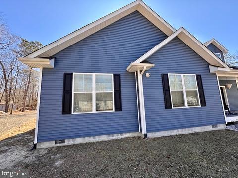 view of side of property featuring crawl space