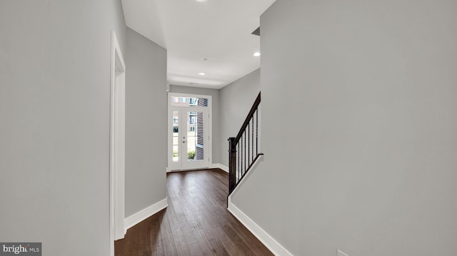 entryway with dark wood-style floors, french doors, recessed lighting, baseboards, and stairs