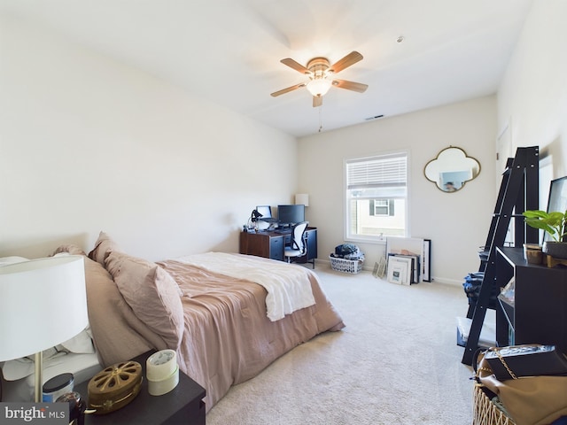 carpeted bedroom with ceiling fan, visible vents, and baseboards