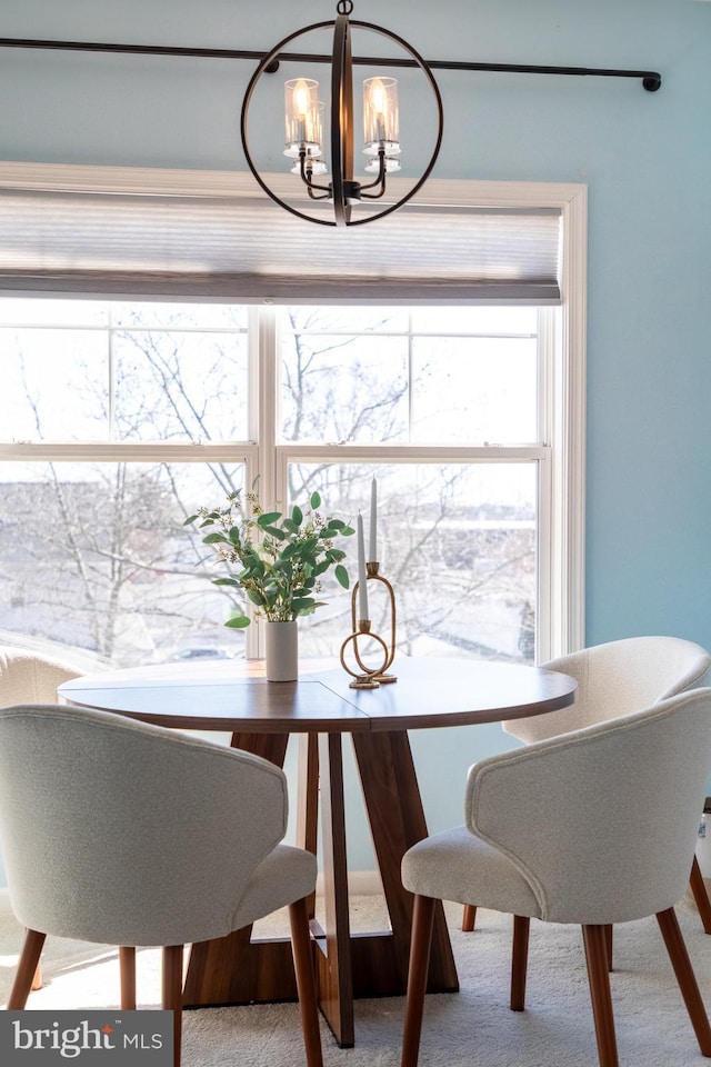 dining space featuring an inviting chandelier