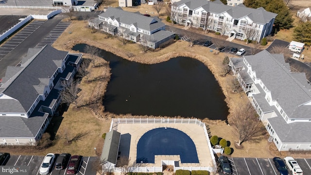 aerial view featuring a water view and a residential view