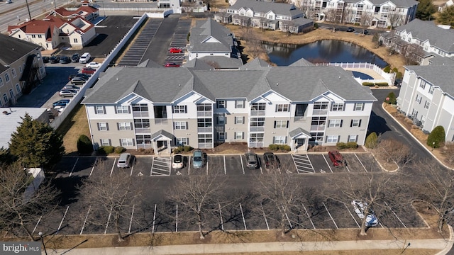 aerial view with a water view and a residential view