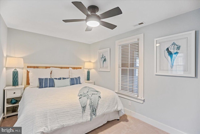 bedroom with carpet, baseboards, visible vents, and ceiling fan