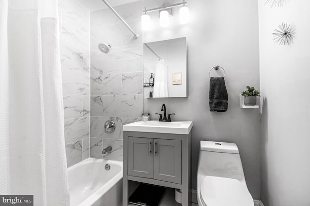 full bath featuring vanity, shower / bath combo with shower curtain, and toilet