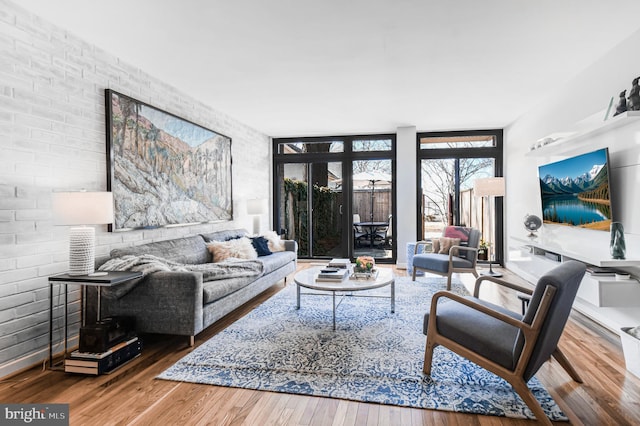 living area featuring hardwood / wood-style flooring and floor to ceiling windows