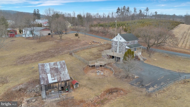 birds eye view of property with a rural view