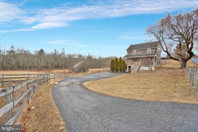 view of street with stairs and a rural view