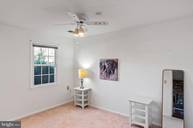 living area with ceiling fan, visible vents, baseboards, and carpet flooring