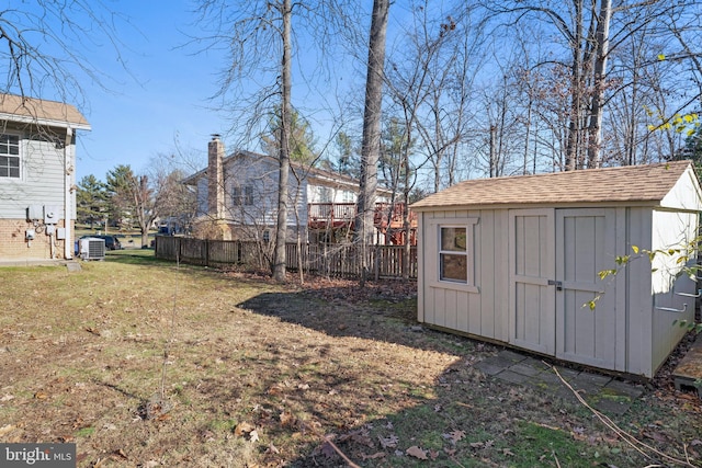 view of shed featuring fence