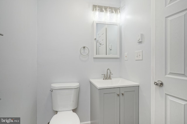 half bath with vanity and toilet