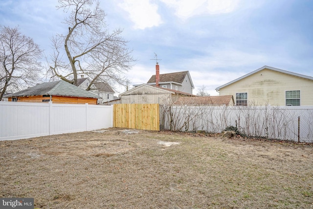 view of yard with a fenced backyard