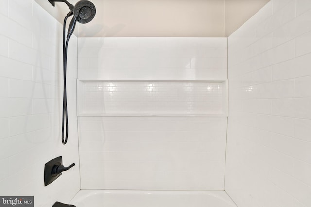 bathroom with shower / bathing tub combination