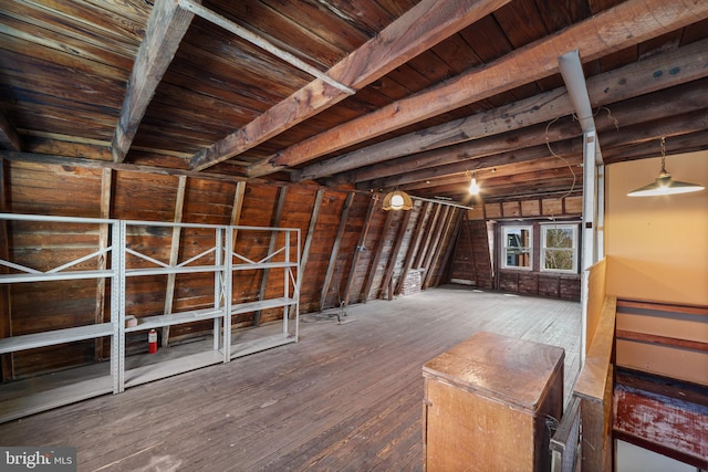 basement with wood ceiling and hardwood / wood-style floors