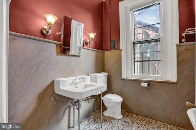 half bath with a sink and toilet