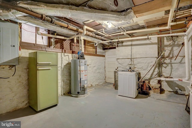 unfinished below grade area with electric panel and water heater