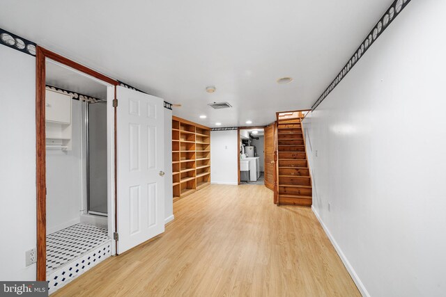 interior space with light wood finished floors, recessed lighting, visible vents, stairway, and baseboards