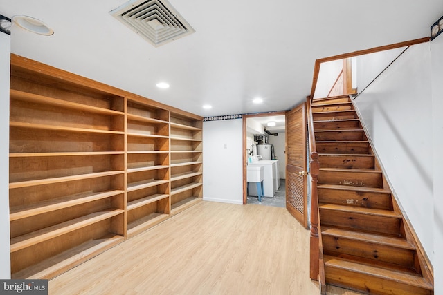 spacious closet with wood finished floors and visible vents