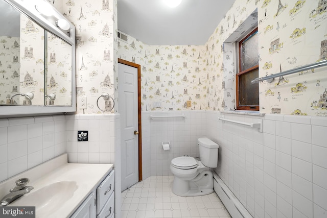 bathroom with wallpapered walls, visible vents, wainscoting, toilet, and vanity