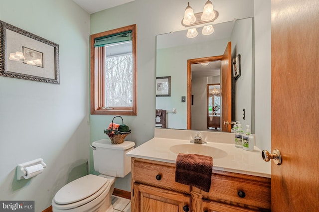 bathroom featuring vanity and toilet