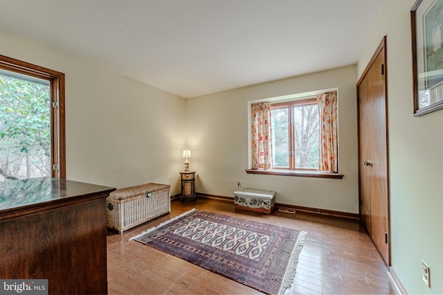 bedroom with light wood-style flooring and baseboards