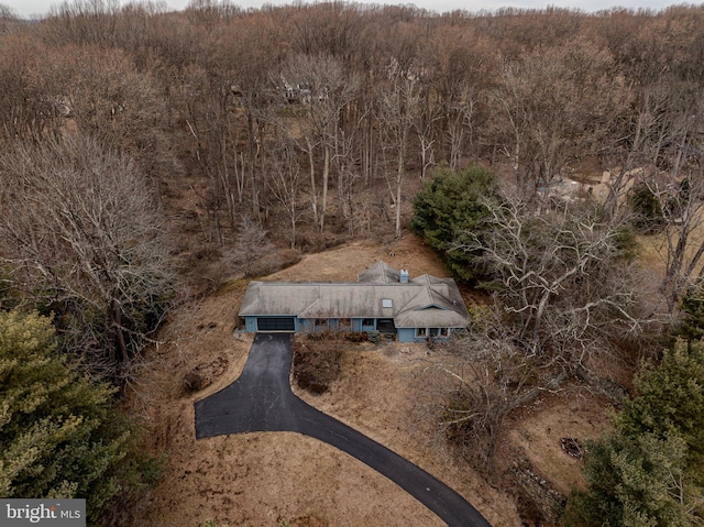 bird's eye view featuring a view of trees