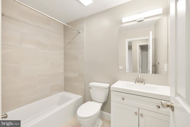 bathroom featuring toilet, vanity, and shower / tub combination
