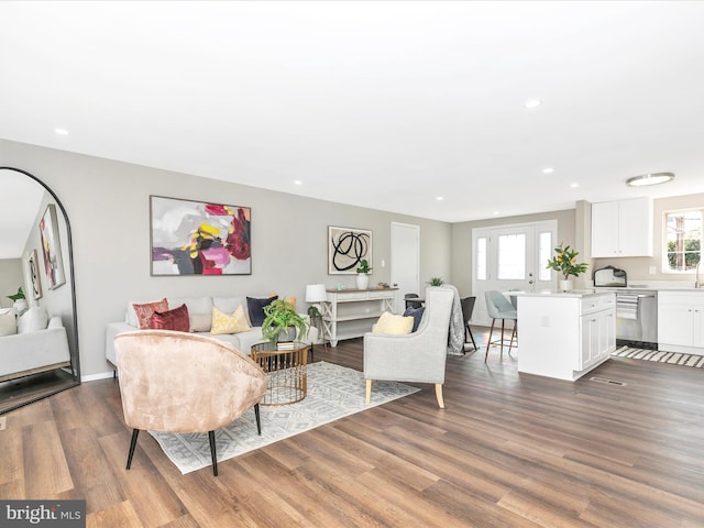 living room featuring wood finished floors and recessed lighting