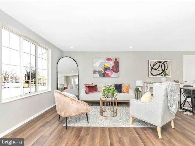 living room with recessed lighting, wood finished floors, and baseboards