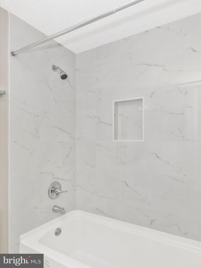 full bathroom with shower / tub combination