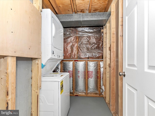 laundry area with stacked washer and dryer and laundry area