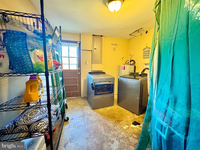 laundry area featuring electric water heater, laundry area, independent washer and dryer, and electric panel