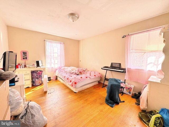 bedroom with light wood-style floors