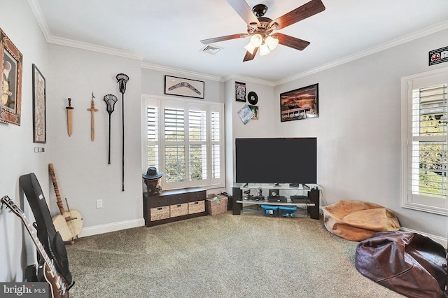 interior space with ornamental molding, carpet floors, a wealth of natural light, and visible vents