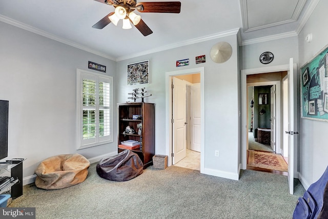 interior space with baseboards, ceiling fan, carpet flooring, and crown molding