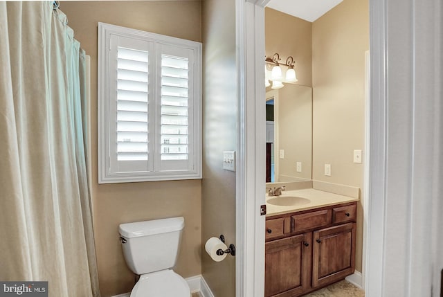 full bath with toilet and vanity