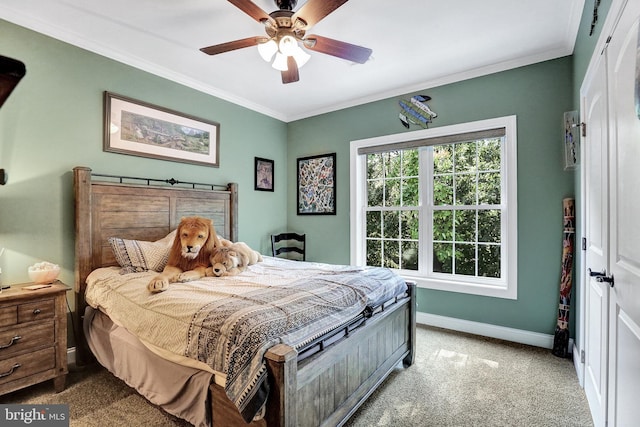 bedroom with ornamental molding, ceiling fan, carpet floors, and baseboards