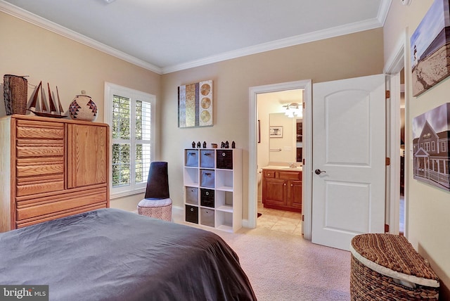 bedroom with ornamental molding, light carpet, a sink, and ensuite bathroom