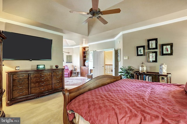 bedroom featuring light carpet, ceiling fan, vaulted ceiling, and crown molding