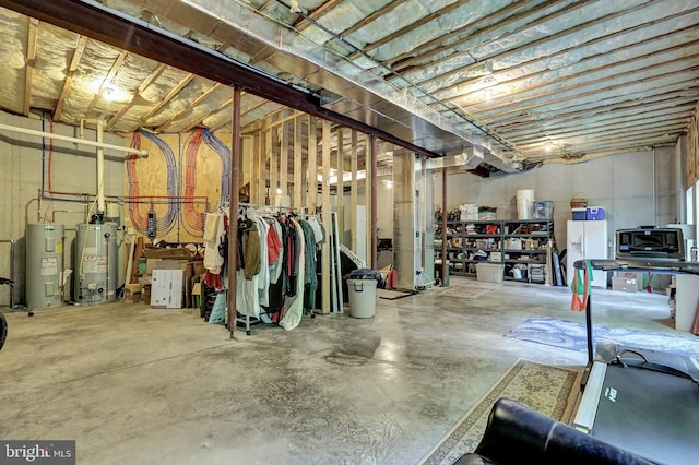 unfinished basement featuring water heater