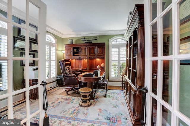 office space featuring plenty of natural light, ornamental molding, and french doors