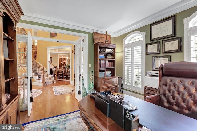 office featuring ornamental molding and wood finished floors