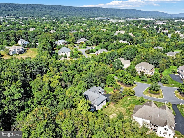 birds eye view of property featuring a residential view and a view of trees