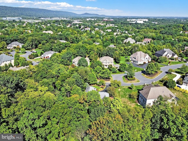 aerial view with a residential view, a wooded view, and a mountain view