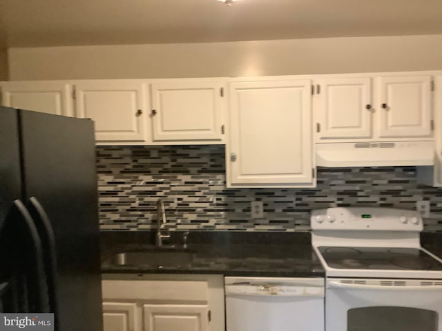 kitchen with white appliances, white cabinets, a sink, and under cabinet range hood