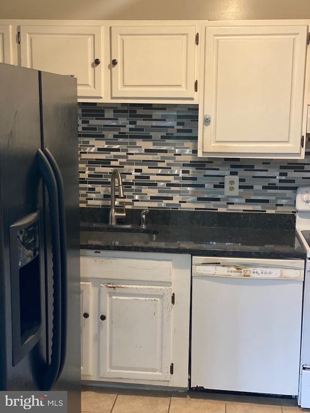 kitchen featuring dishwasher, a sink, black fridge with ice dispenser, and white cabinetry