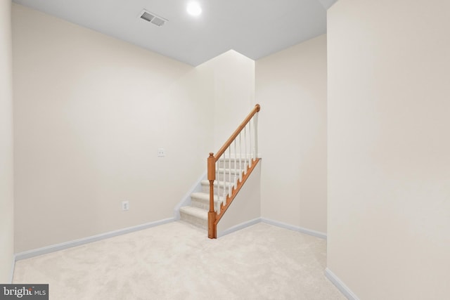 interior space with carpet, visible vents, and baseboards