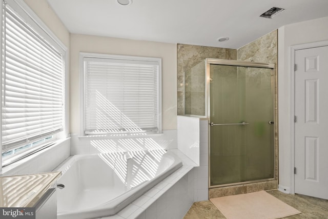 full bath with a stall shower, visible vents, vanity, and a bath