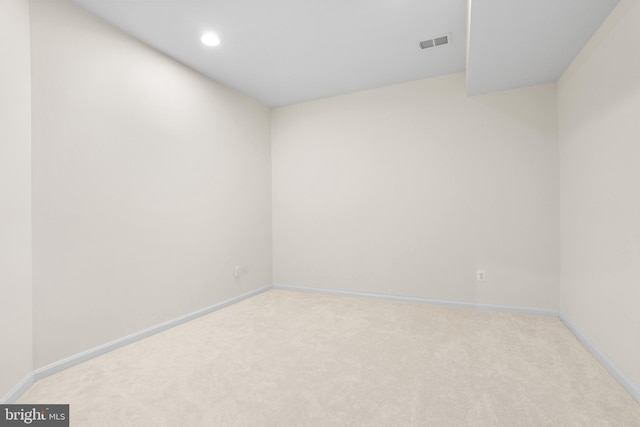 unfurnished room featuring recessed lighting, baseboards, visible vents, and carpet flooring