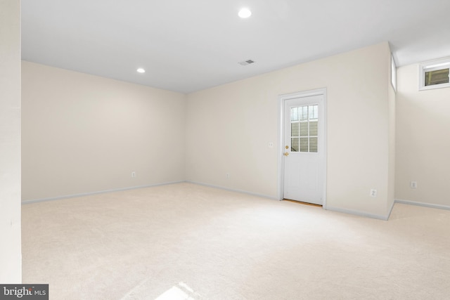 empty room featuring recessed lighting, visible vents, baseboards, and light colored carpet