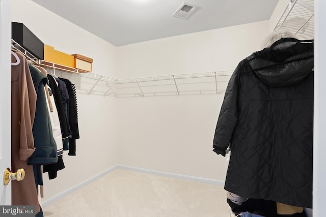 spacious closet with light carpet and visible vents